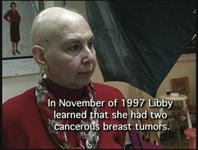 Libby in a red suit jacket.  With text: In November of 1997 Libby learned that she had two cancerous breast tumors.