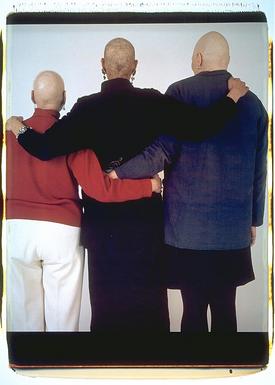 All 3, standing, with backs to camera